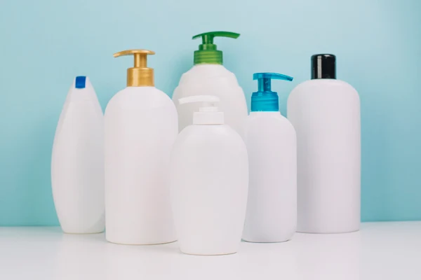 multiple white plastic cosmetic lotion bottles for different applications multiple white plastic cosmetic lotion bottles for different applications
